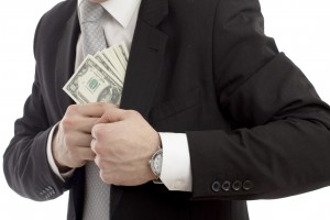Man putting money in his pocket.